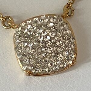 Dazzling pav’e crystal necklace by the iconic Kate spade .